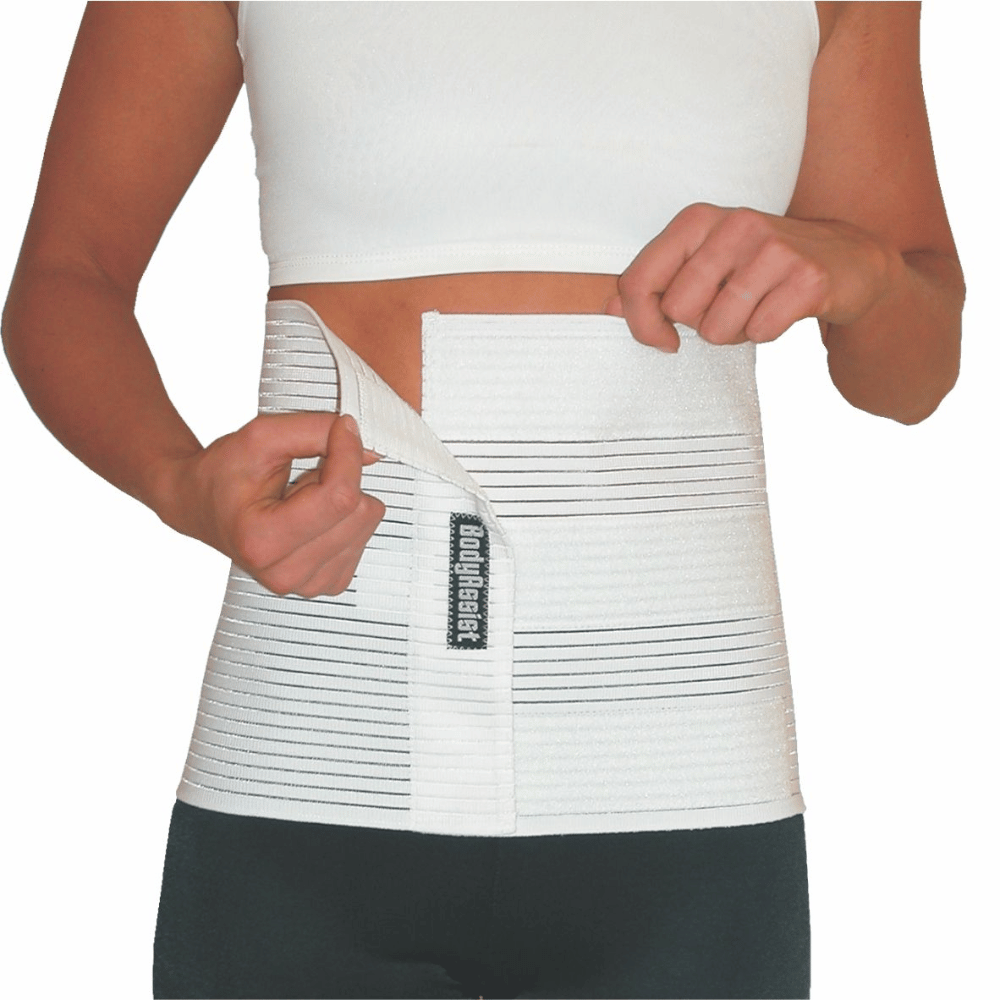 Woman wearing BodyAssist Lightweight Abdominal Binder, showcasing its breathable and supportive design.